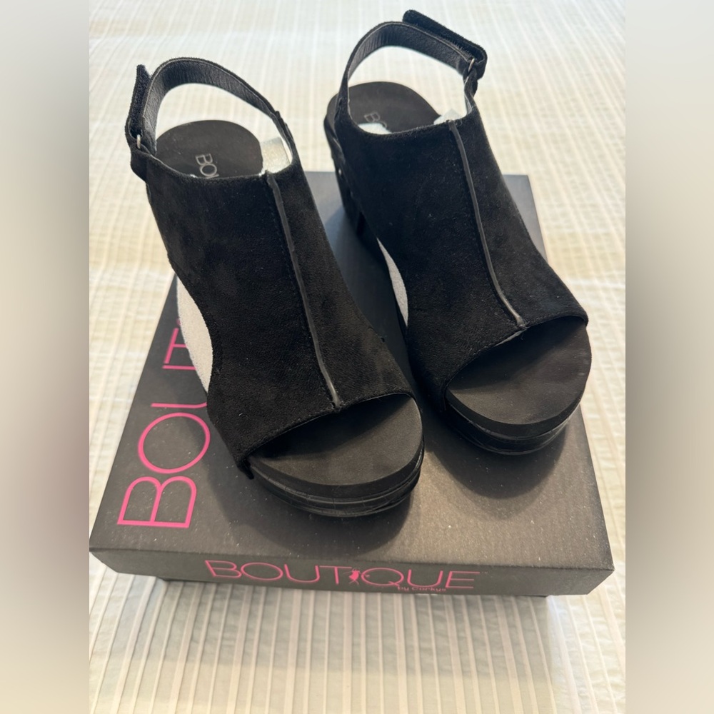 Corky’s Carley platforms in black. Size 8